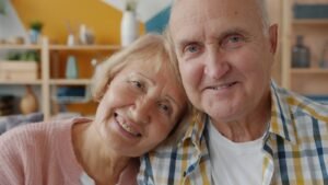 Elderly couple smiling together indoors